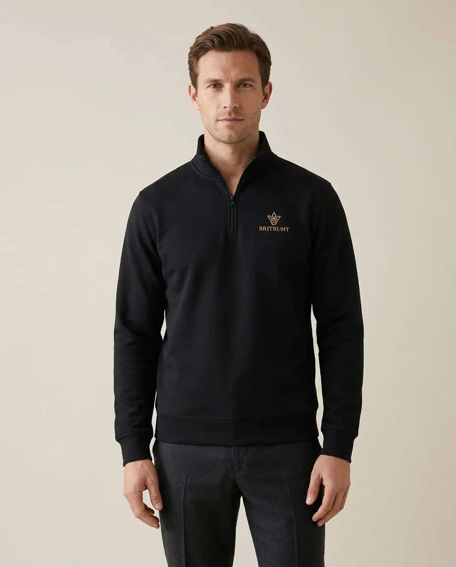 A model wearing the Signature Collection in black, with the gold Britbunt crown embroidered on the chest